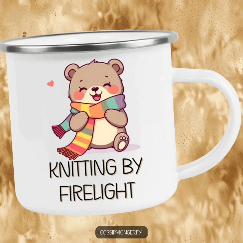 Funny camping mug displaying a joyous bear happily knitting a long, colorful scarf by a campfire.