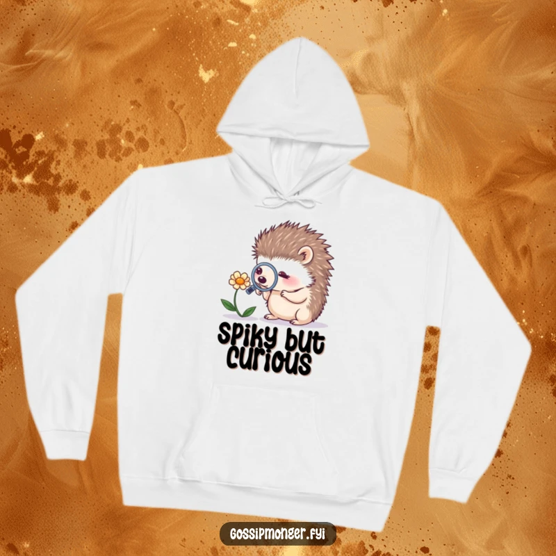 Funny tiny hedgehog using a magnifying glass on a whispering flower, depicted on a warm hoodie, perfect for a humorous gift.