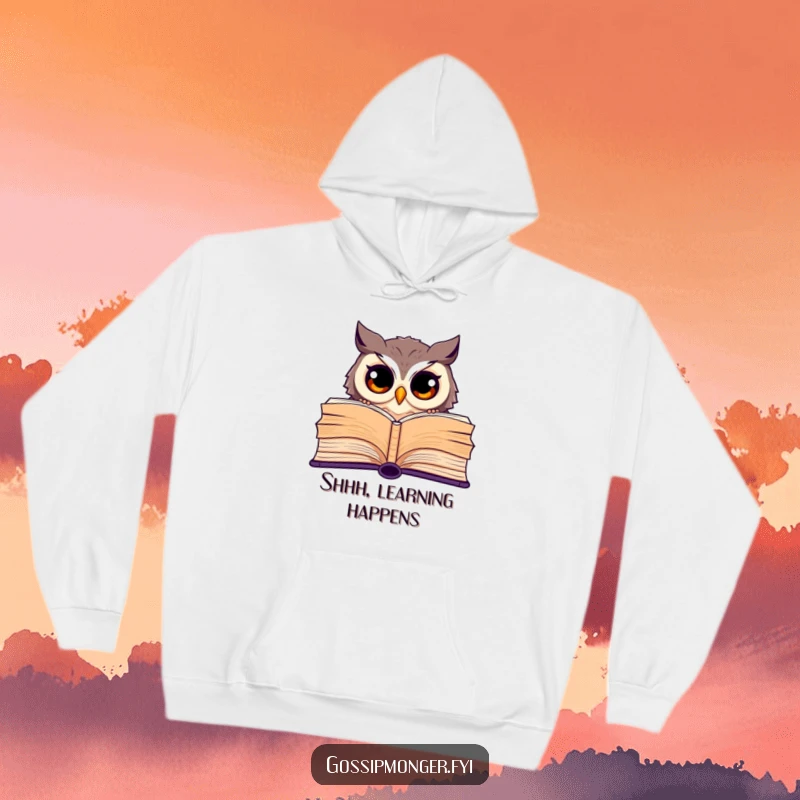 Funny hoodie featuring a curious owl with wide eyes peeking from behind a giant open book, perfect for readers.