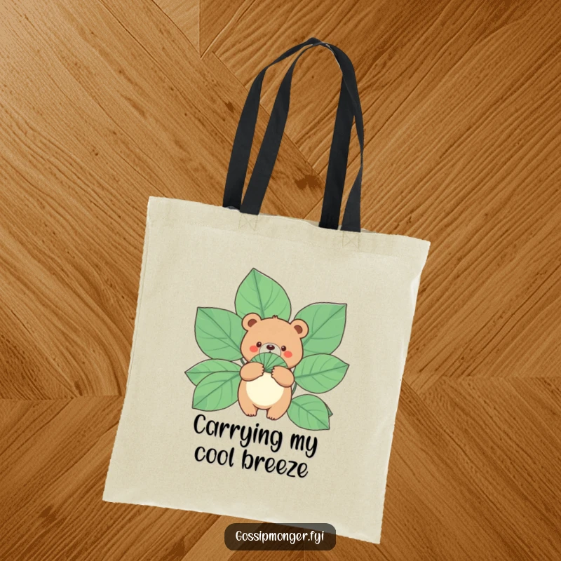 Funny Bear Tote Bag: A small, round bear holds a fan made of gigantic leaves, great for a humorous and practical gift.